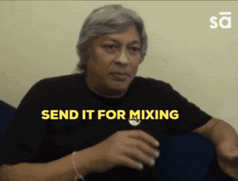 a man in a black shirt with the words send it for mixing above him