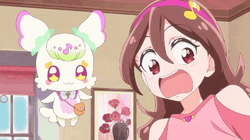 a girl with a surprised look on her face stands next to a cartoon character with music notes on its head