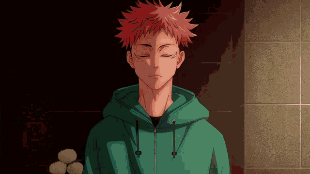 a man with red hair is wearing a green hoodie with his eyes closed
