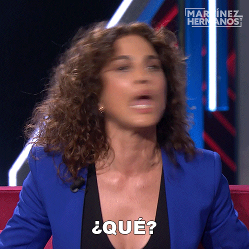 a woman in a blue jacket says " que "