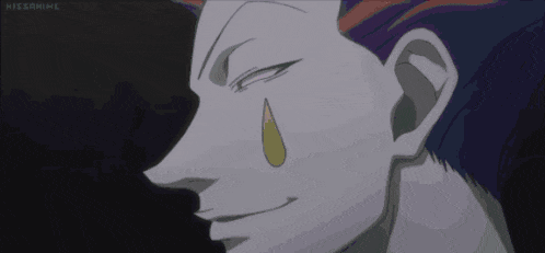 a close up of a person 's face with a yellow tear coming out of his nose .