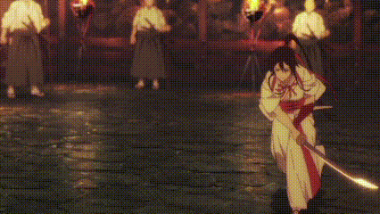 a woman in a kimono is holding a sword in her hand while standing on a street .