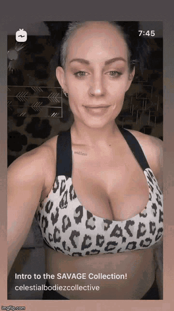 a woman in a leopard print sports bra is taking a selfie