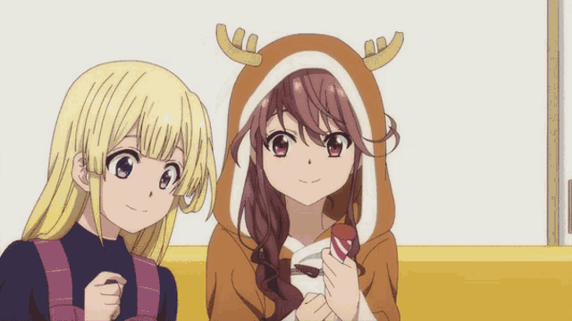 two anime girls are standing next to each other and one of them is wearing a reindeer costume