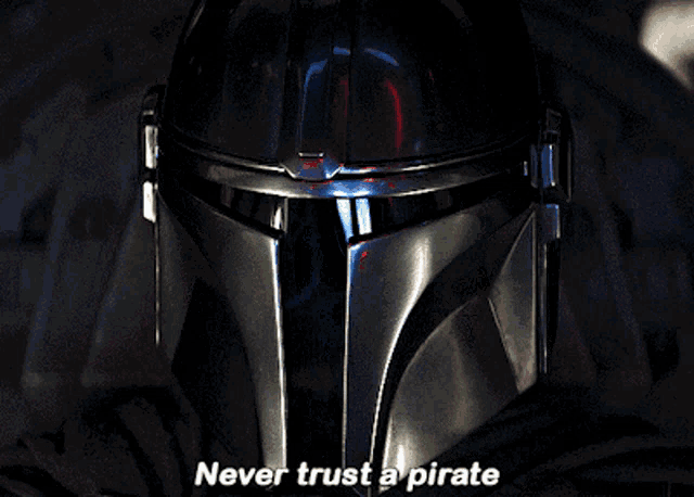a close up of a helmet with the words never trust a pirate above it