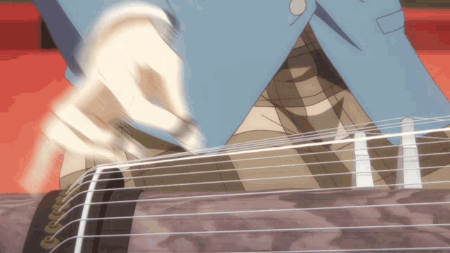 a man in a blue suit is playing a guitar