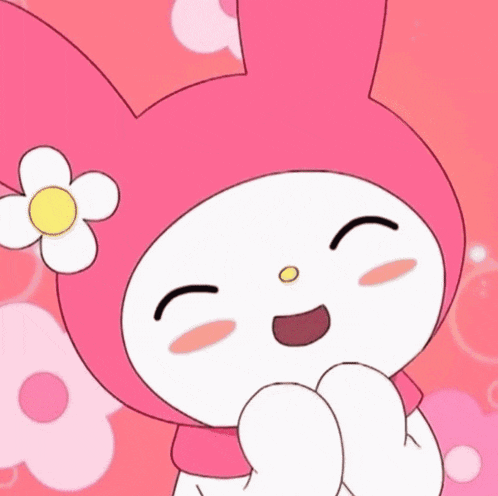 a pink bunny with a flower on its head is smiling