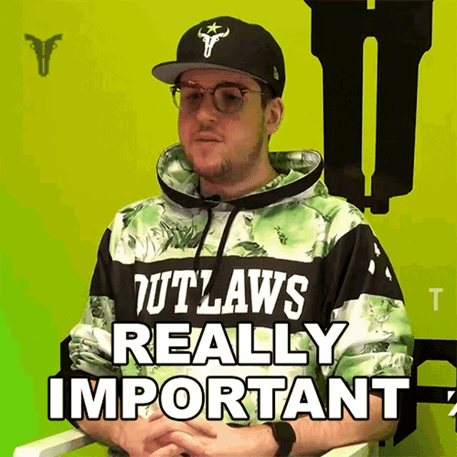 a man wearing a hoodie that says " outlaws really important "