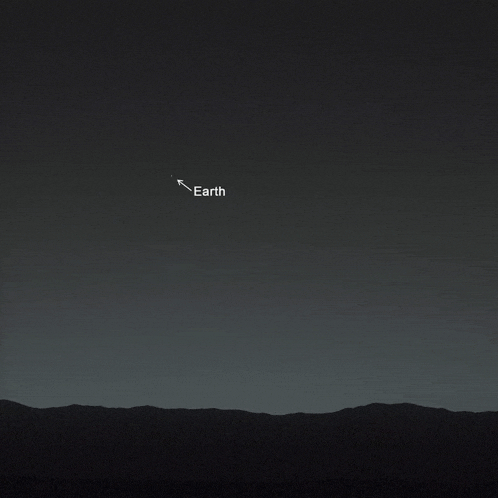 a dark night sky with a white arrow pointing to earth