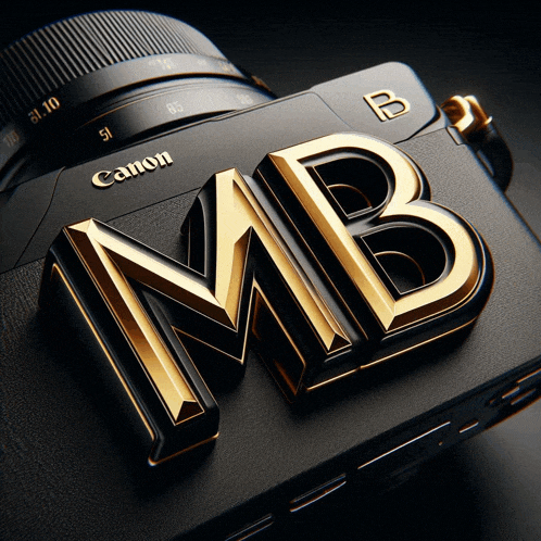 a black canon camera with a gold mb logo on it