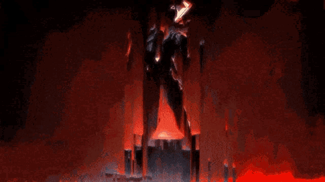 a statue of a robot is standing in a dark room with a red background .
