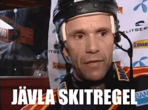 a hockey player wearing a helmet and headphones with the words " javila skitregel " above him