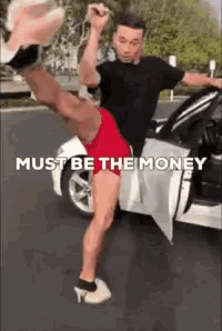 a man is kicking his leg out of a car with the words must be the money above him