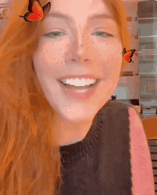 a close up of a woman with a butterfly on her face