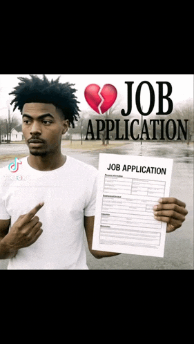 a man is holding a job application with a broken heart on it