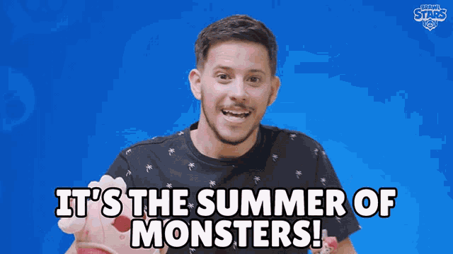 a man says it 's the summer of monsters in front of a blue background