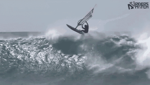 a person riding a wave in the ocean with riders match written on the bottom right