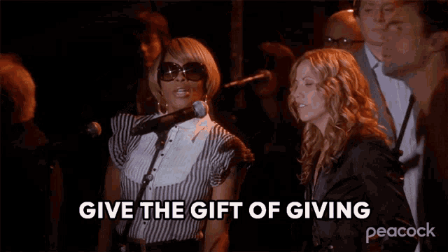 a woman singing into a microphone with the words give the gift of giving peacock on the bottom
