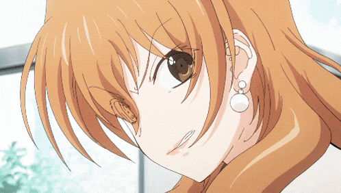 a close up of a girl 's face with earrings