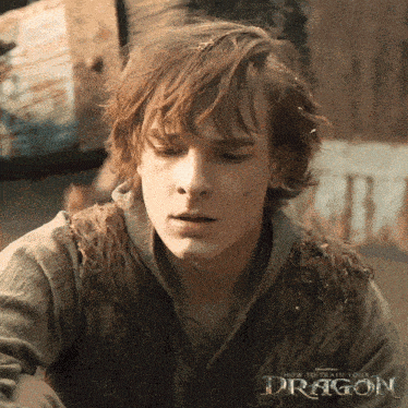 a close up of a man 's face with the words how to train your dragon below him