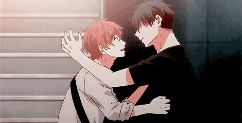 a couple of anime characters hugging each other in a staircase