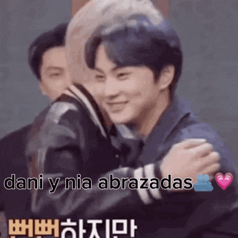 a couple of men hugging each other with the words `` dani y nia abrazadas '' written above them .