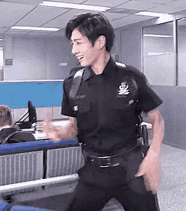 a man in a police uniform is dancing in a room