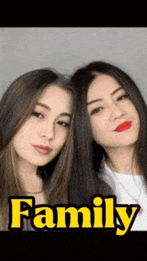 two women are posing for a picture with the word family in the background