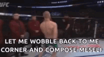 a man in a boxing ring with a caption that says let me wobble back to me corner and compose meself