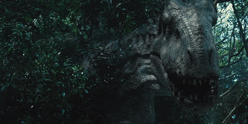 a close up of a dinosaur in a forest