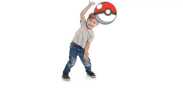 a little boy is playing with a poke ball