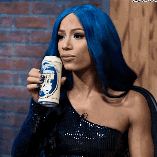 a woman with blue hair is drinking from a can of bud light