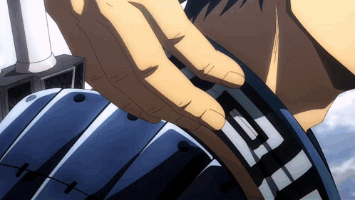 a close up of a person 's hand holding a device that says g on it