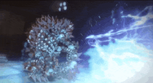 a close up of a glowing object in the dark with a lightning bolt coming out of it .