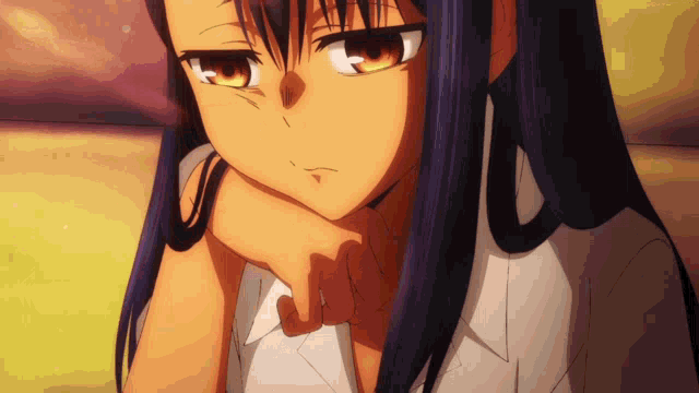 a close up of a girl 's face with her hand on her face