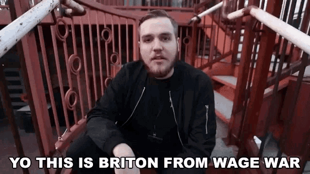a man sitting on a set of stairs with the words yo this is briton from wage war above him