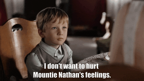 a little boy sits at a table with the words i don t want to hurt mountie nathan