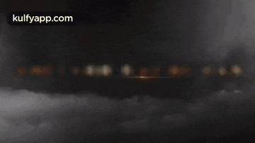 a movie poster for amitabh bachchan shows a cloudy sky