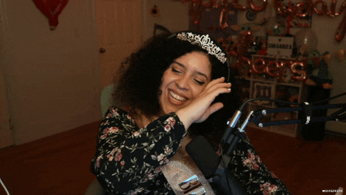 a woman wearing a tiara and a sash that says bridesmaid