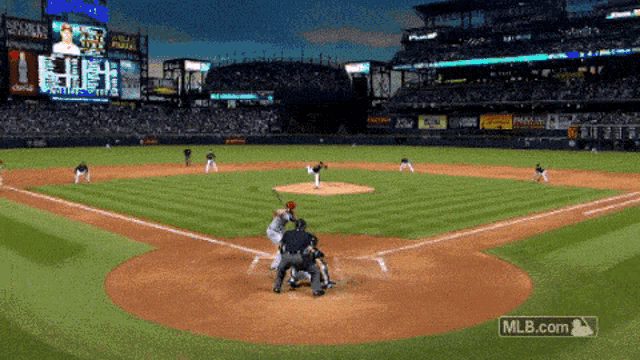 a baseball game is being played in a stadium with mlb.com on the bottom of the screen