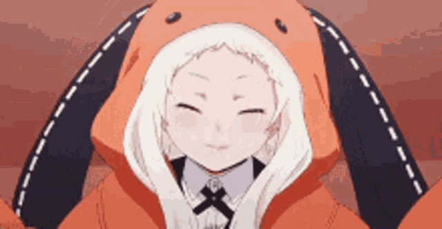 a close up of a girl wearing a bunny hooded jacket .