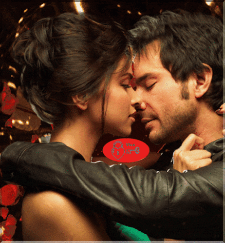 a picture of a man and woman kissing with a red circle that says " love " on it