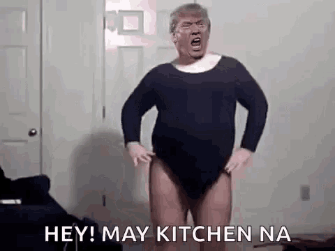 a man in a black leotard is standing in a room and screaming .