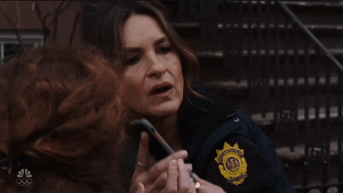 a woman in a police uniform has a patch on her arm that says new york city