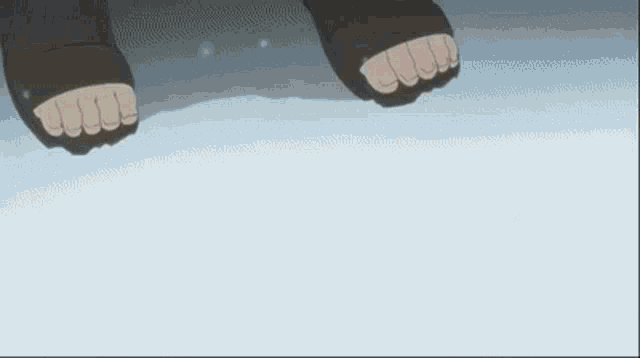 a person is standing in the snow with their feet in the snow .