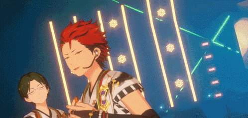 a man with red hair is standing next to another man with green hair in front of a blue background .