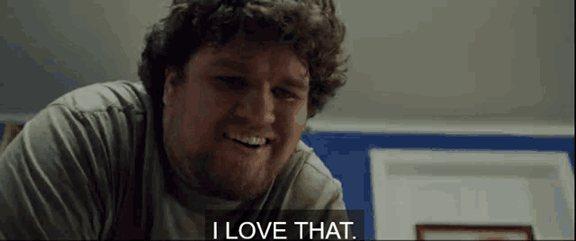 a man with curly hair and a beard says i love that