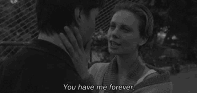 a black and white photo of a man and woman with the words " you have me forever " written on the bottom