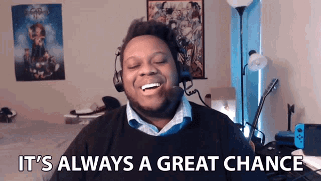 a man wearing headphones is smiling with the words it 's always a great chance below him