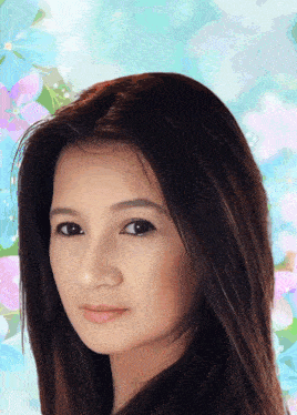 a close up of a woman 's face against a blue background with flowers